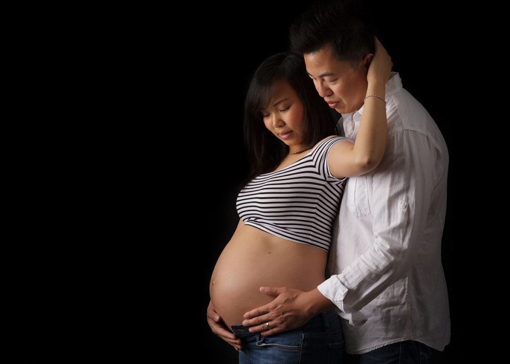 alt=intimate maternity couple picture