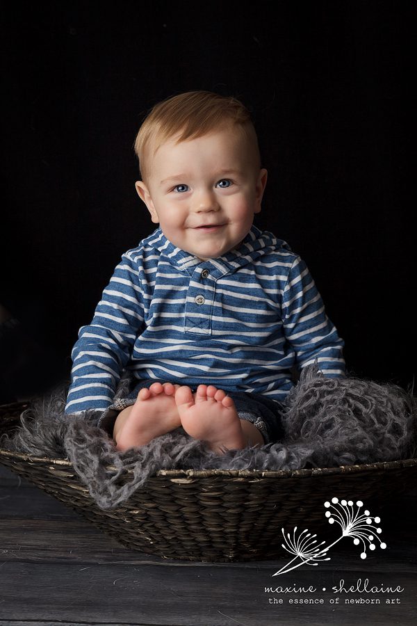 alt=smiling toddler in basket, alt=Edmonton family photographers