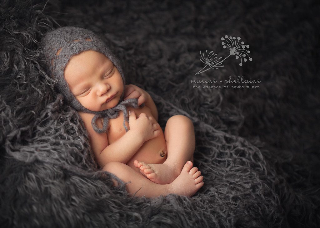 alt=baby on grey fur, alt=Edmonton newborn photographers