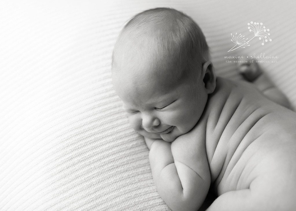 alt=black and white newborn photography 