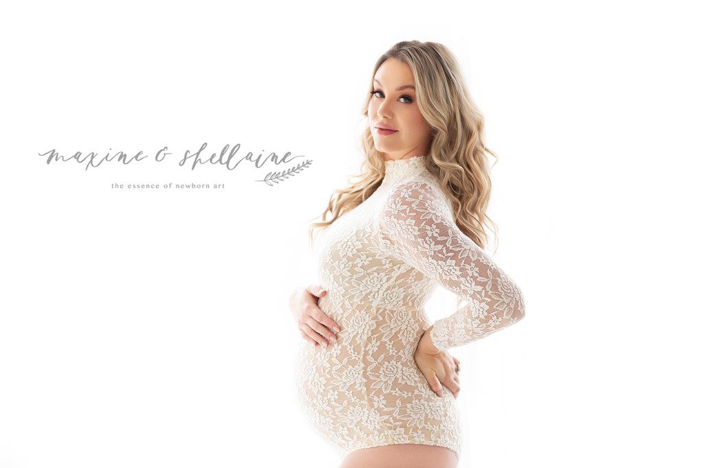 alt=Mii Estilio, alt=boutique style maternity dresses, alt=pregnant woman in white lace bodysuit, alt=high key maternity image, alt=light and airy studio maternity Edmonton