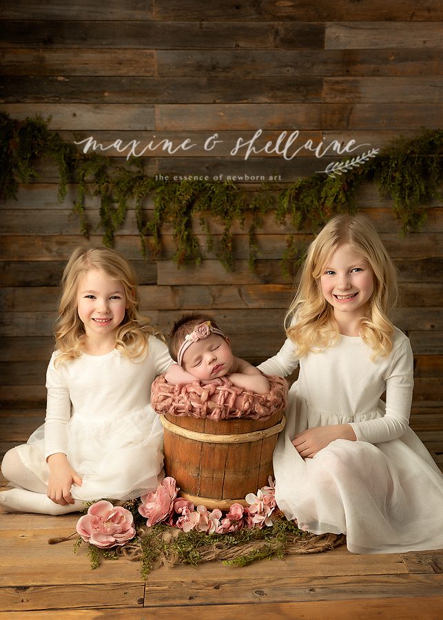 alt=sibling photos, alt=newborn and sibling pictures, alt=family photographers, alt=Edmonton photographers, alt=baby prop and sisters