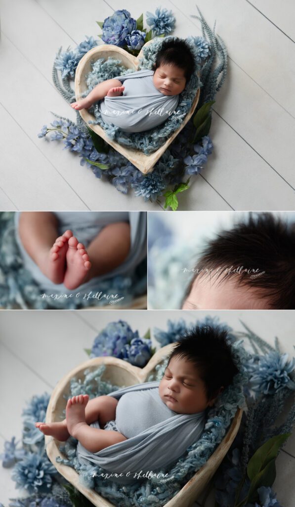 alt=Sleeping baby boy in blue heart bowl during Edmonton newborn photography session